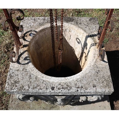 Ancient stone well. Louis XIV era. 